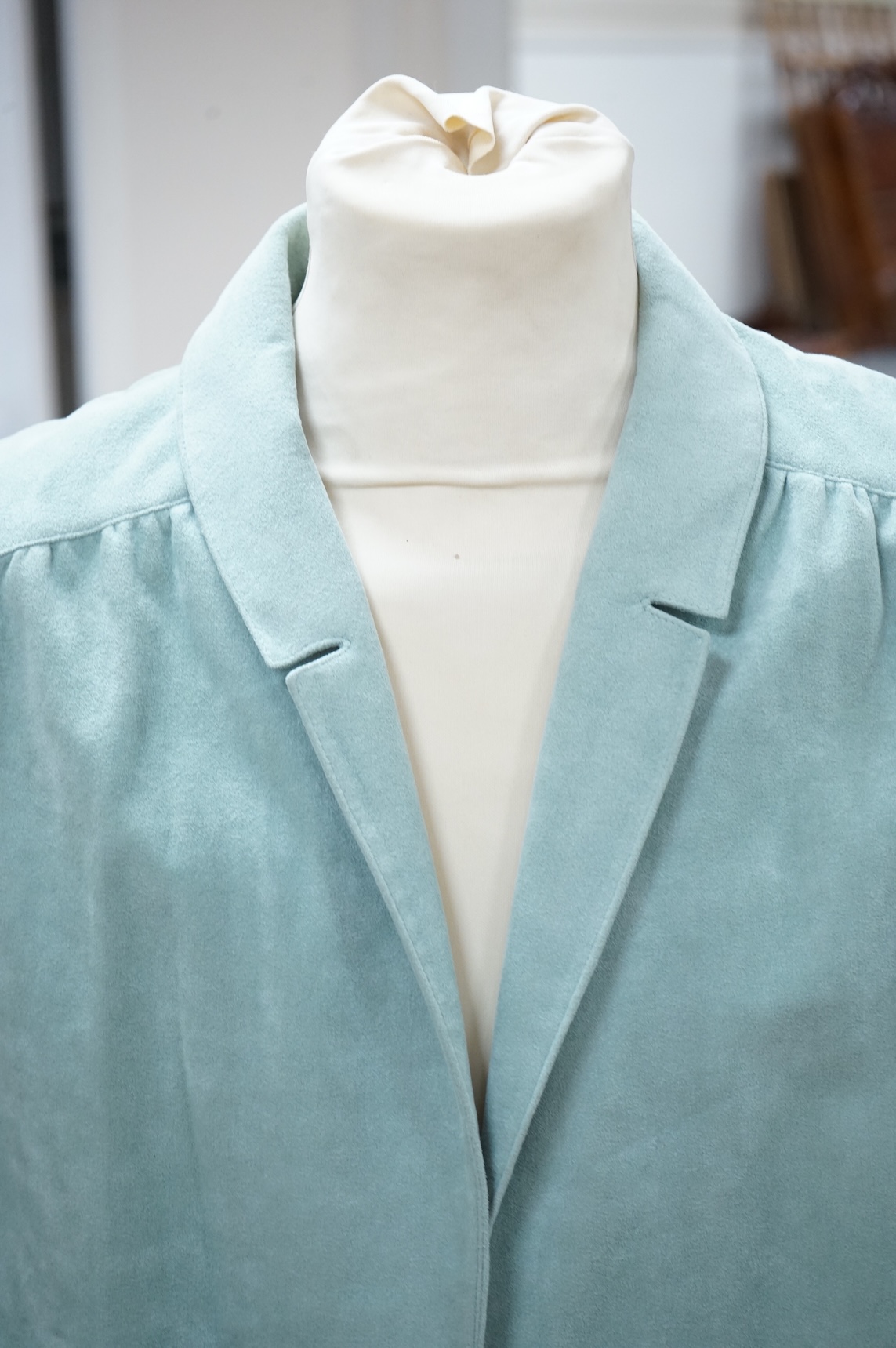 A Vera Maxwell navy blue suede jacket, a Vera Maxwell pistachio green jacket & skirt suit and a Cache d'Or jacket & skirt suit
